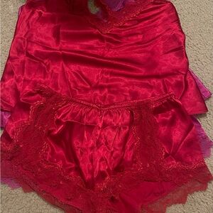 Satin pajama set size small 2 colors. Fuscia and red $20 each lace backing